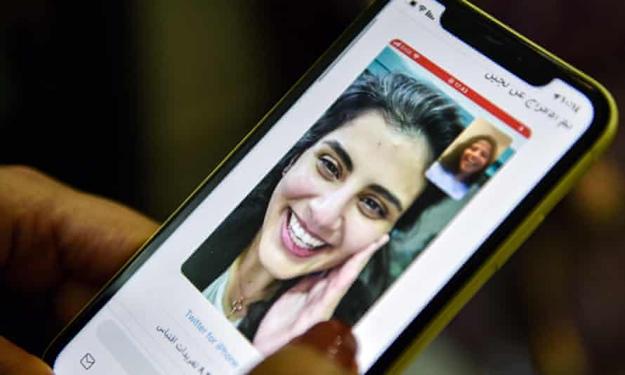 A woman in Riyadh views a tweet posted by Loujain al-Hathloul’s sister Lina on Wednesday.