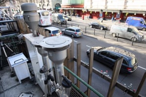 Traffic drives past air quality monitoring equipment on Marylebone Road in London, England