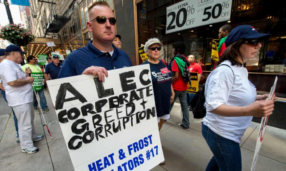 A coalition of community, labor and environmental groups protest in Chicago, where the American Legislative Exchange Council (Alec) is holding its 40th annual meeting. 