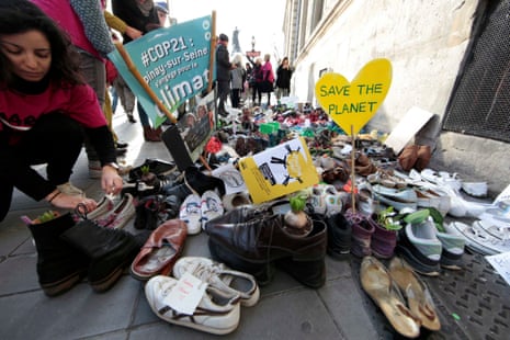Shoes are symbolically placed on a sidewalk in Paris near the Place de la Republique.