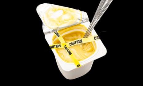 A pot of yellow yoghurt with yellow tape across the top saying CAUTION