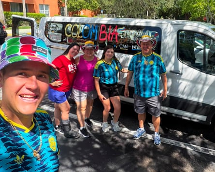 Juan Carlos Mila and his family pinch their mini van.