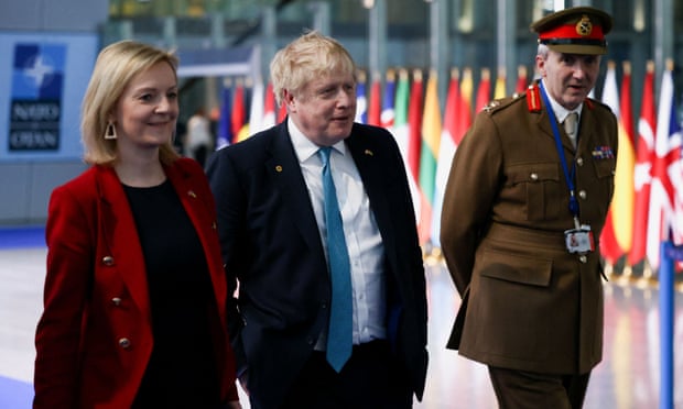 Liz Truss, Boris Johnson and military representative to Nato Ben Bathurst leave a Nato summit on Russia’s invasion of Ukraine, in Brussels, Belgium