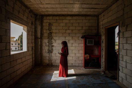 Abir, 17, a Syrian girl in the structure, still under construction, in El Kneisset in the Akkar area in northern Lebanon, where she lives with 14 other people