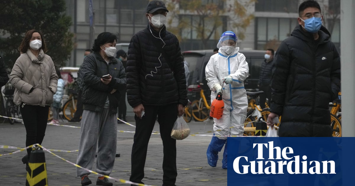 China imposes new lockdowns as local Covid cases hit record high – The Guardian