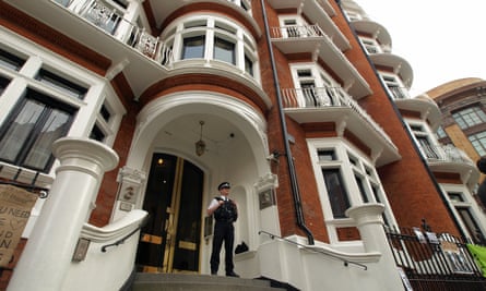 A policeman stands guard at the door of the Ecuadorian embassy in Knightsbridge, London.