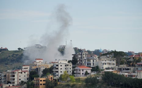 Lebanese emergency responders attending to casualties from airstrikes in southern villages