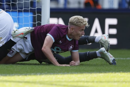 Burnley's Joe Westley finds himself tangled in legs after scoring against Huddersfield Town during a pre-season friendly.