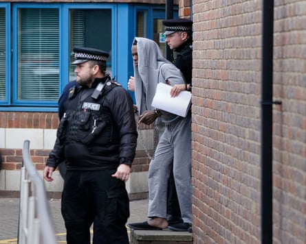 Mark Gordon leaving Crawley police station to attend magistrates court in March 2023.
