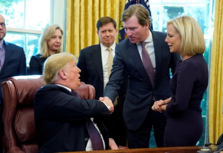 Then President Trump shakes hands with Chris Krebs, who was put in charge of protecting the integrity of the 2020 election. Trump would later fire Krebs for rejecting Trump’s claims of election fraud.