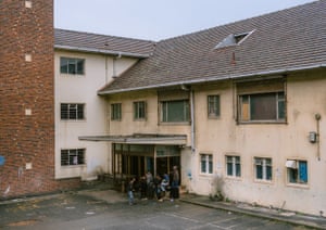 Residents and children living in the occupation play in the courtyard of the building