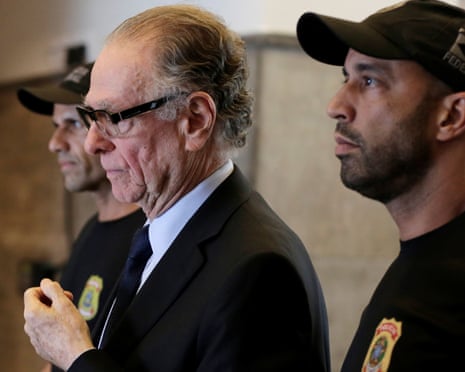 Brazilian Olympic Committee president Carlos Nuzman is escorted from the federal police headquarters in Rio de Janeiro.