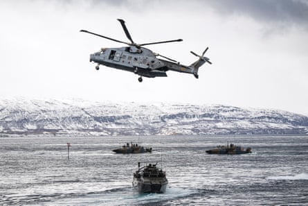Helicopter and ships with snowy hill in background