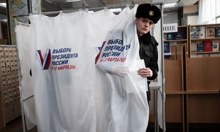 A student of the Maritime State University leaves a voting booth.