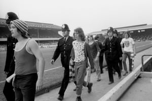 A small group of fans are escorted out of Highbury by the police prior to kick-off. Wolves won the match 3-1.
