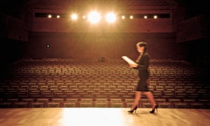 Woman walking across stage