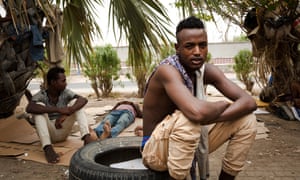 A young African migrant rests in a park frequented by Ethiopians in the port city of Aden