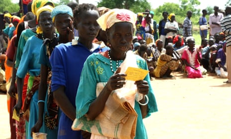 People line up for food distributions near the town of Aweil in Northern Bahr el Ghazal