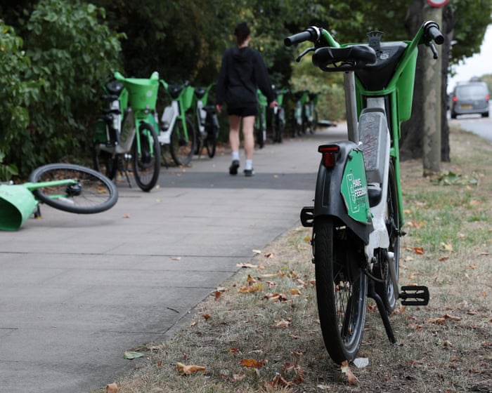 ‘A nuisance and an eyesore’: hire ebikes accumulate at London border between rival firms