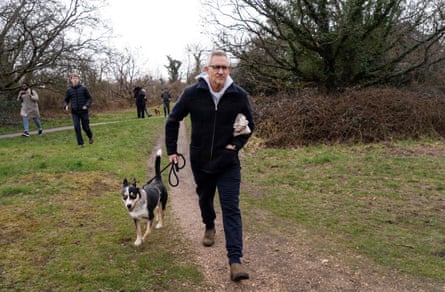 Gary Lineker attempts to walk his dog near his London home amid the scrutiny that followed his suspension from Match of the Day in March 2023.