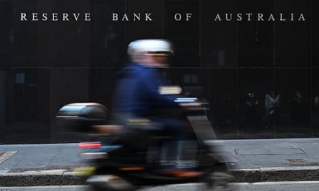 People walk past the Reserve Bank of Australia in Sydney