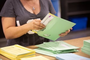 A worker verifies ballots at a facility in Phoenix, Arizona.