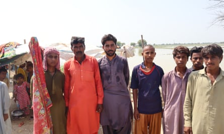 Farmer Sohail Ahmed, 22, fifth from the right, posing with family members.
