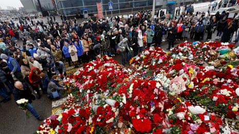 Mourners pay tribute to Moscow attack victims outside Crocus concert hall – video