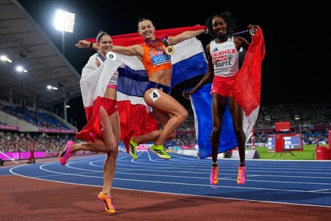 Netherlands' Nadine Visser, gold, Poland's Pia Skrzyszowska, silver, and France's Laeticia Bapte, bronze, celebrate after the women's 100m hurdles final.