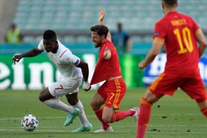 Breel Embolo has a tug of Joe Allen’s jersey.
