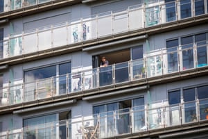 a man standing on a balcony