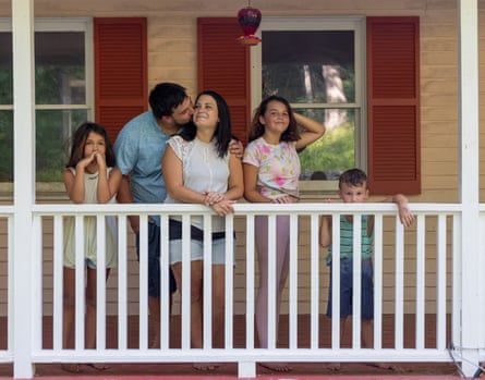Heather Breault with her husband and three children on the porch of a house in Connecticut