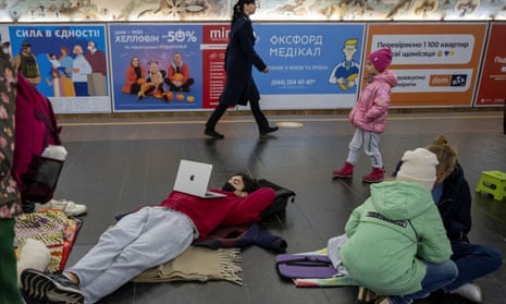 People shelter inside a subway station during a Russian missile attack in Kyiv.