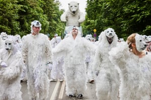 Skanderborg, Denmark. The Italian carnival troupe La Compagnia del Carnevale and members of VIA University College Aarhus take part in procession at Smukfest, a forest-based music festival.