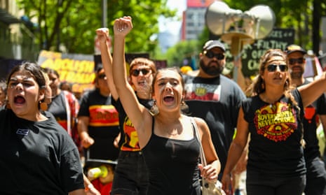 Protesters march from Victoria’s Parliament House to Flinders Street Station during the Treaty Before Voice Invasion Day protest in Melbourne on Thursday. 