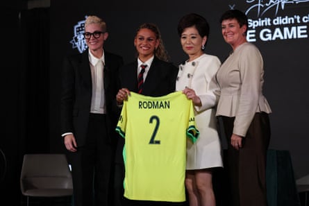 (From left to right) Haley Carter, Washington Spirit’s president of soccer operations, Trinity Rodman, Michele Kang, the team’s owner, and Kim Stone, the chief executive officer, pose for a photo
