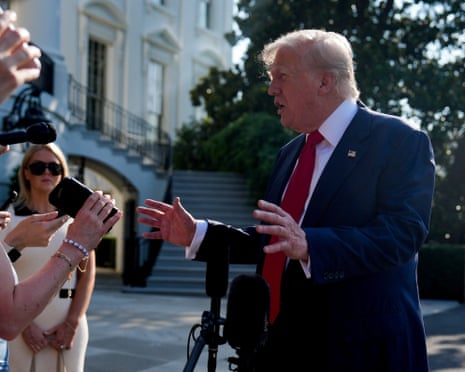 Donald Trump speaks to the members of the press outside the White House before departing for Scotland.