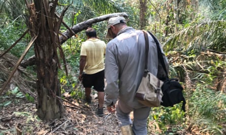 Bernardo, a local Indigenous man, leads archaeologist Umberto Lombardo into the forest.