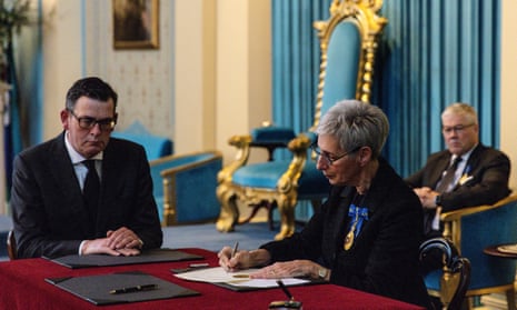 Governor of Victoria Linda Dessau (centre) signs proclamation documents as Victorian Premier Daniel Andrews looks on during a King Charles III Proclamation Ceremony at Government House in Melbourne.