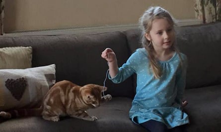 Eliza Adamson-Hopper playing with her cat Mittens