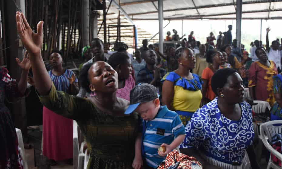 Worshippers attend mass at a church in Dar es Salaam this month without wearing masks or practising social distancing.