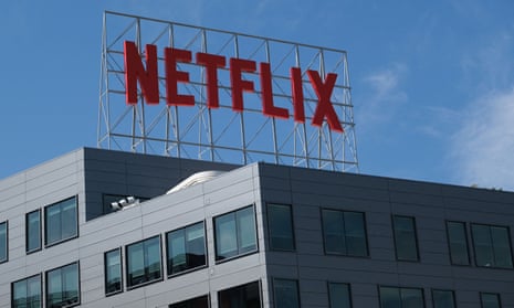 The Netflix logo is seen on top of a building in Hollywood.
