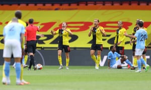 Watford players react as referee Micheal Oliver awards the penalty.