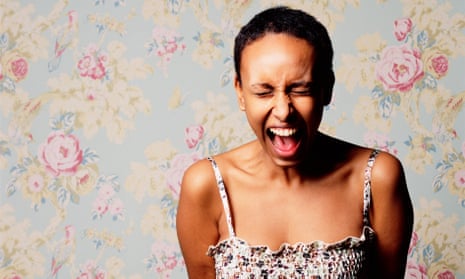 A woman screaming against a pastel wallpaper background 