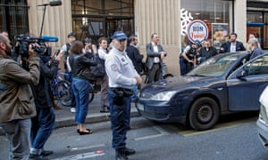 Police officers outside HQ of La France Insoumise in Paris