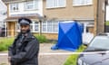 Semi-detached house with Met police office on driveway and blue forensic tent at door
