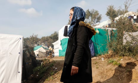 Jalila, 18, stands on the path where she slept on her first night in the Moria camp.