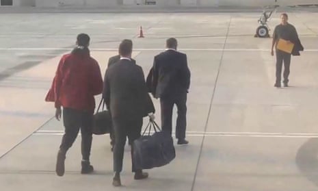 Footage released by Russia of Viktor Bout (right) and Brittney Griner (left) on the tarmac in Abu Dhabi.