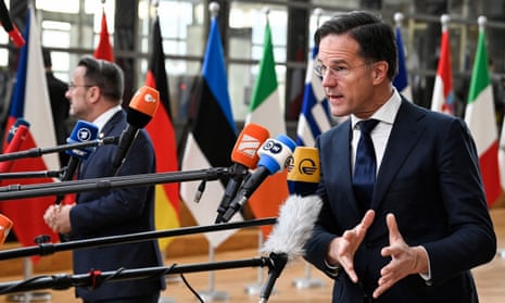 The Netherlands prime minister, Mark Rutte, speaks to the press as he arrives for a summit at EU parliament in Brussels.