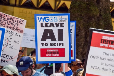 A person holds a sign that reads 'leave AI to scifi'